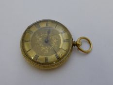 A lady`s continental pocket watch, the watch having a gold tested back cover floral engraving to the