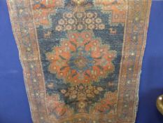 An antique Middle Eastern wool carpet