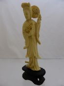 Chinese Ivory Figure, the demure woman with a fan held behind her head.