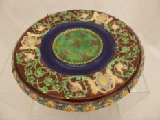 Continental Majolica Earthen ware Wall Plate depicting cherubs, birds and acanthus leaf scroll.