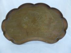 A shell shaped Arts and Crafts copper tray engraved with fish, possibly Newlyn School, approx. 58