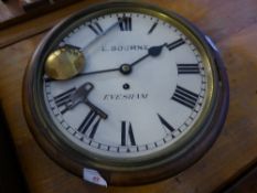 Mahogany Wall Clock with cream enamel face and black Roman numerals, E Bourne Evesham.