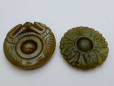 Two antique jade spheres - one carved with a dragon clasping a ball with loose carved sphere to