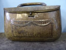 A vintage Huntley and Palmers biscuit box being in the form of a handbag