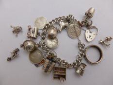 A silver hallmarked identity bracelet with heart shaped clasp with thirteen charms, three loose