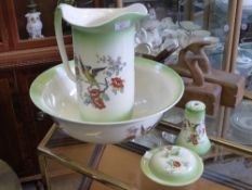 A Victorian wash basin and jug together with a talc holder and soap dish, hand painted with