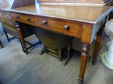 A Victorian mahogany hall table having two drawers on turned legs, approx. 105 x 48 x 73 cms.