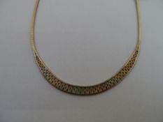 A 9ct gold hallmarked tri-gold necklace having rose, yellow and white gold links, approx. 14 gms.