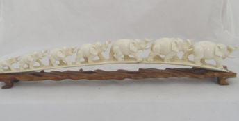 Carved Indian Ivory Composition of Seven Graduated Elephants, 59 cms, waf on a carved wooden base.