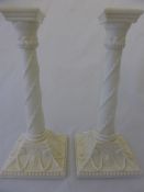 Pair of Royal Worcester `Blanc De Chine` Corinthian style candle sticks. Green Puce marks to the