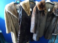 Three fur coats comprising a brown mink 3/4 coat, a brown pony skin coat having a mink collar