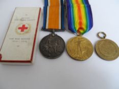 A Great War and Victory medal together with British Red Cross War Medal to K R Dempster VAD