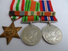 Second World War boxed 39 / 45 Italy Stars, War Medal and Defence Medal with award slip to T H P