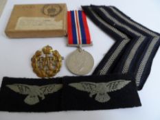 A 1939 / 45 War Medal to J Horsfall together with WAAF cap badge and corporals stripes