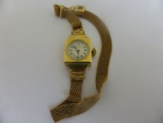 A lady`s 9ct hallmarked gold Bernex dress watch being on a fine mesh bracelet, approx. 10 gms.