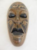 South Seas Wooden Face Mask together with a wooden short spear.