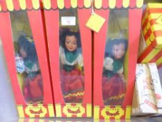 Four Pelham Puppets including Donald Duck and three Gypsy dolls.