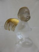 A Lalique Capriccioso Crystal Angel, a frosted glass figurine of an angel in repose with gilt