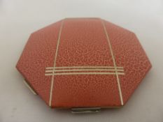 A vintage 1920`s Shagrin compact in the original slip.