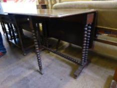 Edwardian Oak Sutherland Table, the table with bobbin legs and stretchers, 91 x 99 x 73 cms.