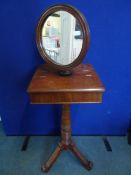 A Victorian gent`s mahogany shaving mirror, the adjustable round mirror supported on a small