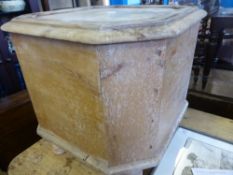 An antique lidded pine pot cupboard