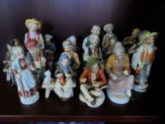 Collection of twenty two ceramic figures depicting various figures at work and play.