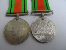 Second World War Defence Medals in separate boxes with slips both to same surname, Chapman, at