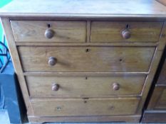 Victorian oak chest of drawers having panelled sides with two short and three long drawers,