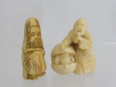 Oriental Ivory Netsuke depicting a jovial figure playing hide and seek, with a child emerging from