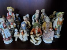 Collection of twenty one ceramic figures depicting various figures at work and play.