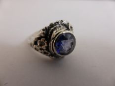 Silver Ring with unusual blue stone, marked silver.