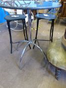 A round marble topped kitchen table on a chrome centre column with four arched feet, approx. 75