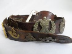 Brown leather "hate" belt with eighteen mainly Canadian second world war badges affixed.