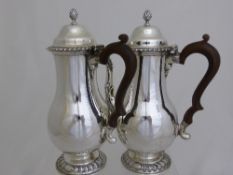 Solid Silver Coffee and Water Jug on ribboned pedestal feet, having ribboned decoration to lid and