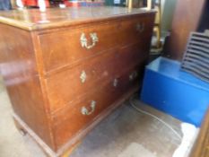 Victorian oak chest of drawers on bracket feet with three graduated drawers having brass drop