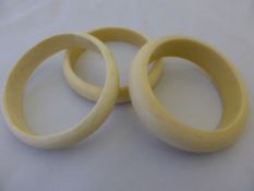 Three ivory bangles