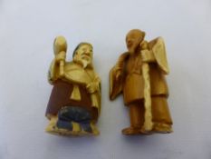 Two Japanese Netsuke both depicting wizened men, one figure is stained with character marks to base.