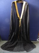 A Middle Eastern gent`s felt bisht, having gold v panel and tassel to back, front edges and cuffs