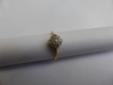 A lady`s 18ct hallmarked gold diamond cluster ring, set with five old cut diamonds, approx. 2.1 gms.