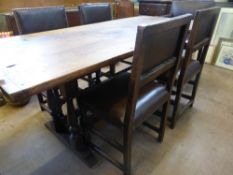 An antique oak refectory table on two turned column supports to each end, each pair of columns on