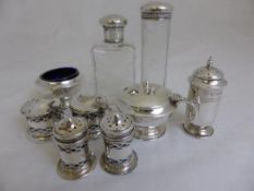 Miscellaneous Silver three mustards, salt and three peppers and two silver topped cut glass bottles.