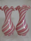 Pair of Victorian pink candy stripe vases, approx. 33 cms. tall.