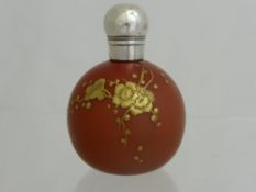 Webb`s spherical silver topped perfume bottle ( 1896 ) in matt amber coloured glass with gold cherry