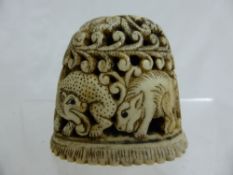 An antique intricate Indian Bone Carving depicting leopard, elephant, bird and deer.