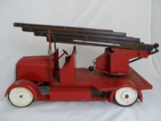 A vintage circa 1940`s hand made fire engine, approx. 68 cms. in length.