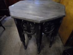 Edwardian occasional table being octagonal in shape with carved decorated frieze, each panel