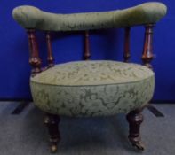 A pair of Victorian tub chairs, the half circular arm and back rest being supported on turned