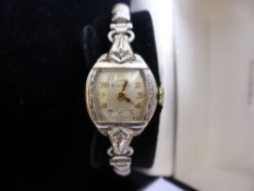 A lady`s 10K rolled gold Bulova L1 wrist watch having silvered Arabic dial , each shoulder set