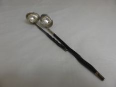 Two Georgian miniature ladles, the ladles on twisted stem silver finial`s one with m.m George